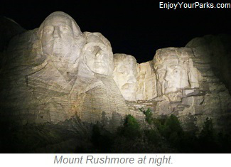 Mount Rushmore at night.