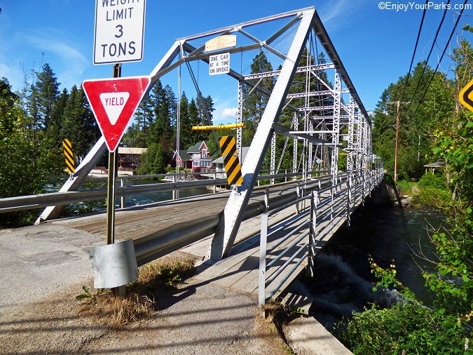 The metal bridge is located at the end of main street at Bigfork