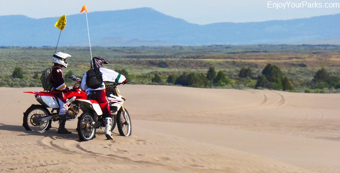 Motorcyclists pausing to take in the view at St. Anthony Sand Dunes Recreation Area.